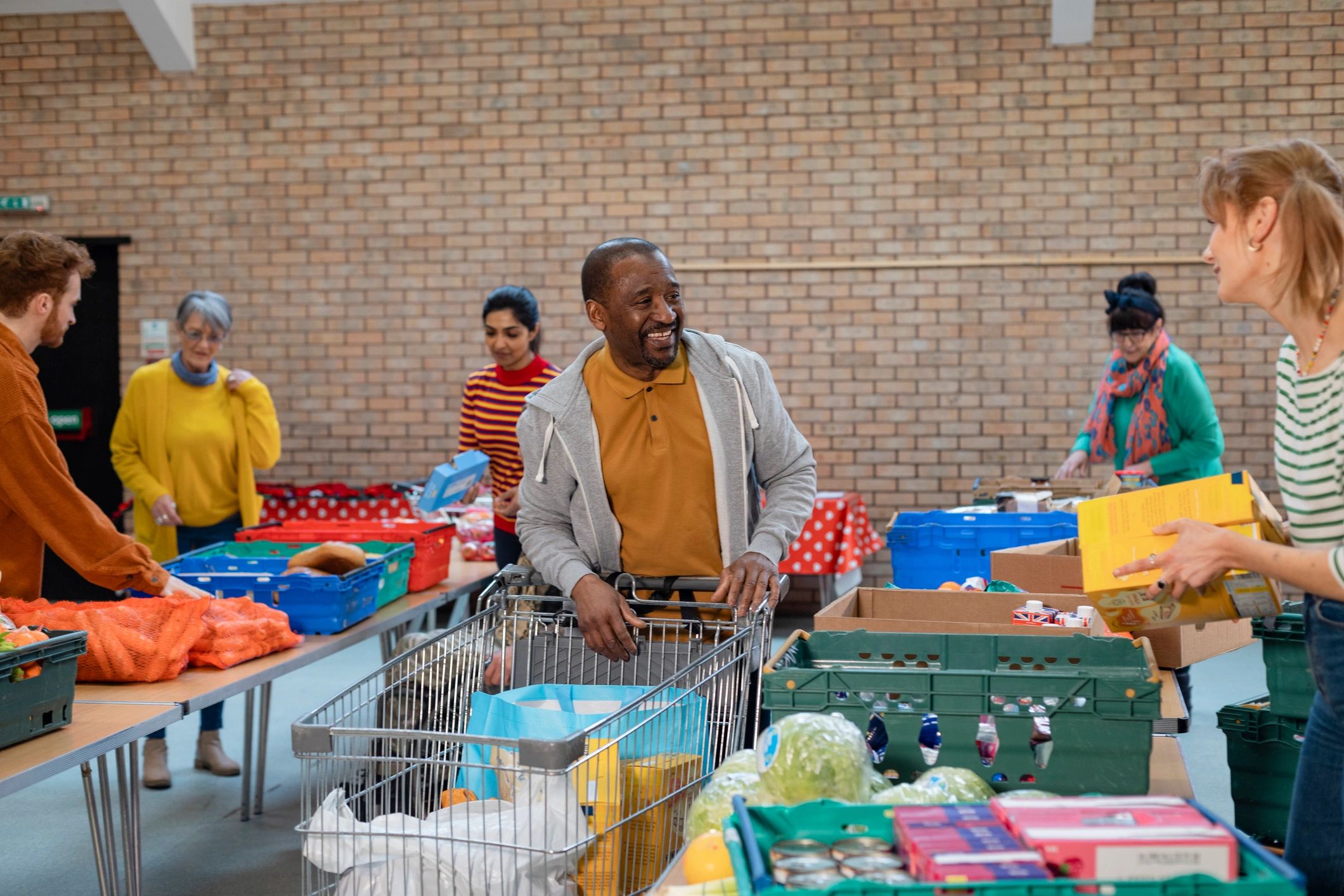 Volunteers organizing donations together in a community setting