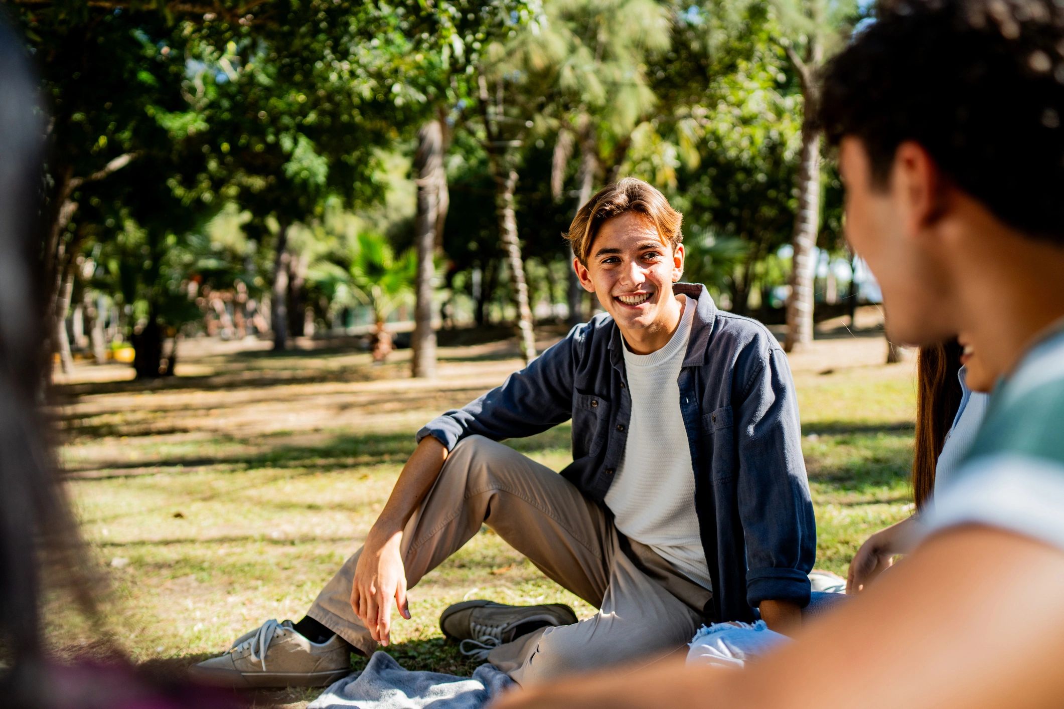Young people connecting outdoors in a public park