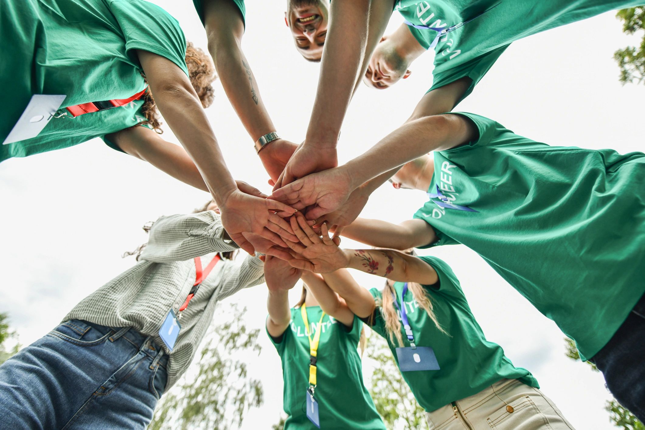 Volunteer team celebrating together outdoors